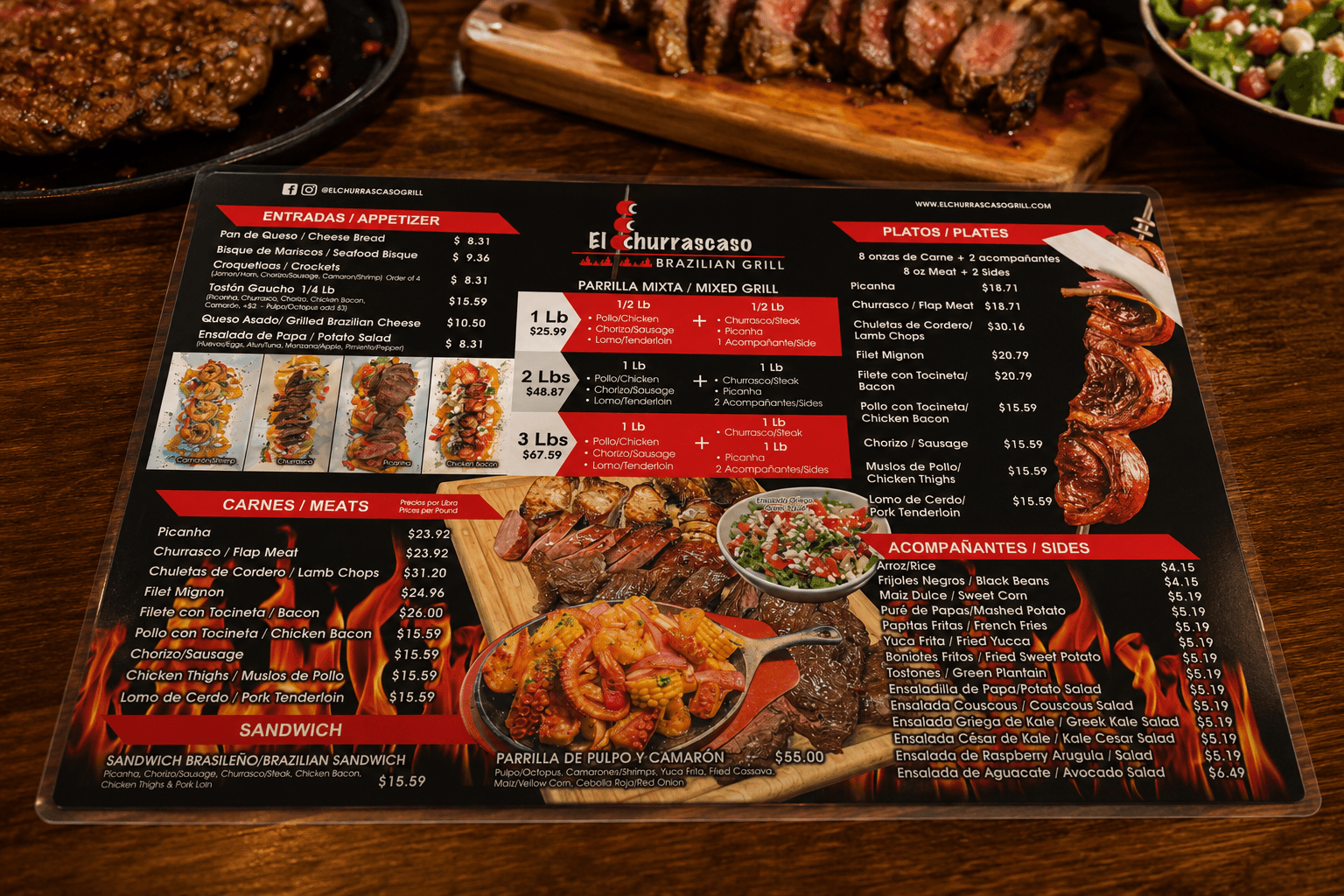 Laminated El Churrascaso plastic menu on a wood table listing appetizers, mixed grills, meats, plates and sides, surrounded by grilled dishes
