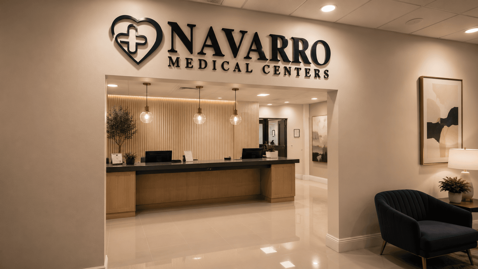 Navarro Medical Centers reception with the dimensional heart-and-cross logo mounted above the waiting-room desk